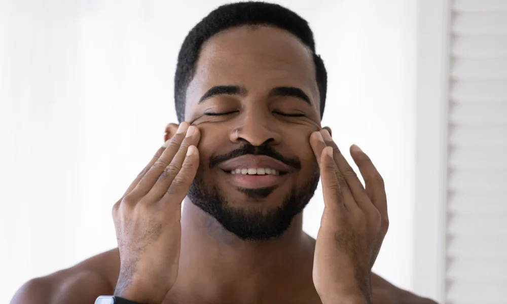 young-man-applying-night-cream-for-men-1000x600